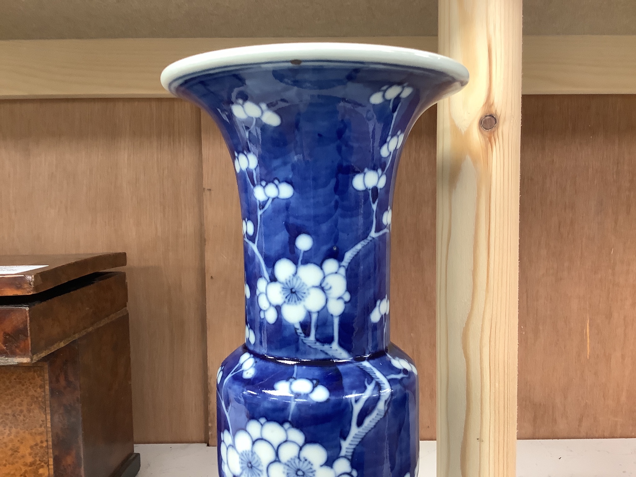 A Chinese blue and white prunus decorated gu vase, 26.5cm